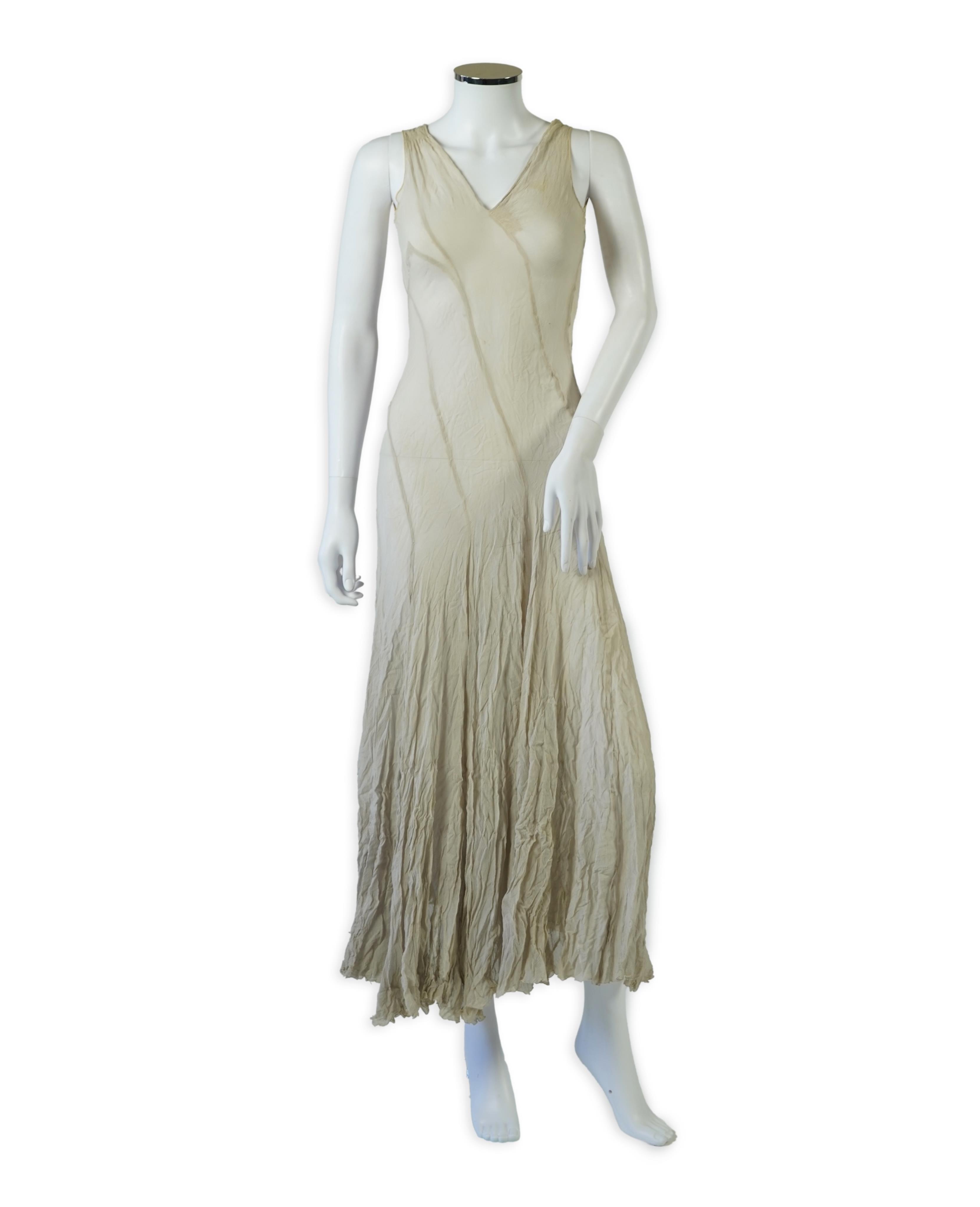 A 1930's grey chiffon bias cut ladies evening dress. 120cm long. Condition - has a small hole at the back and a light mark possibly removed with washing.